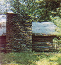 
The property already had a cabin with a stone fireplace.
